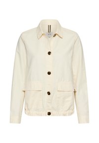 Cream-colored long-sleeve jacket with collar, four dark buttons down front, and two large front flap pockets.