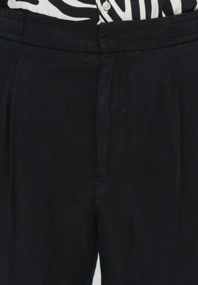 Black pleated trousers with a smooth texture, elastic waistband, and side pockets. Fabrics appear lightweight and comfortable.