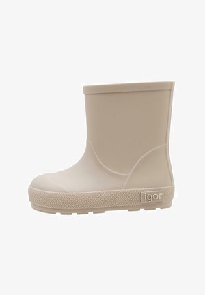 Botte de pluie en caoutchouc beige avec un extérieur lisse, un bout arrondi et une semelle texturée. Présente un petit logo sur le côté et un design minimaliste.