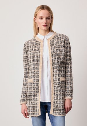 Wollmischungskardigan im karierten Muster mit cremefarbenen und schwarzen Tönen, mit Rundhalsausschnitt, offenem Design und Seitentaschen.