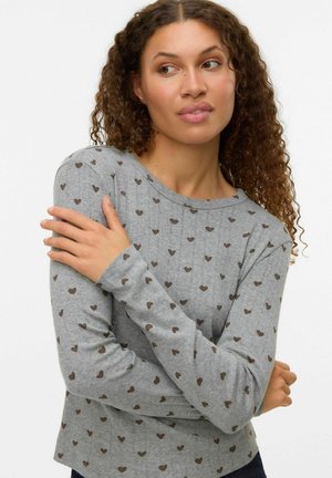Gray long-sleeve shirt with a ribbed texture, featuring a pattern of small brown hearts. Round neckline and fitted sleeves.
