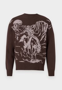 Suéter marrón de punto con un gráfico de vaquero y caballo en beige claro, con cuello redondo y puños acanalados en las mangas y el dobladillo.