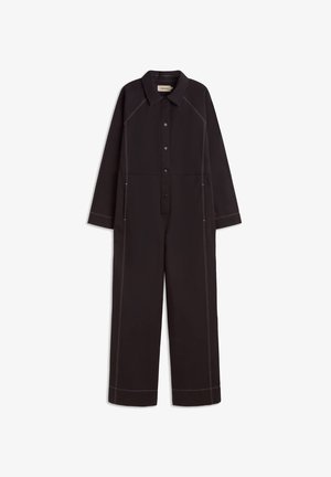 Black jumpsuit with long sleeves, button front, and pointed collar. Contrast stitching accentuates seams. Two front pockets at the waist.