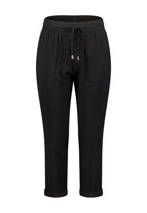 Pantalon noir avec une taille élastique et un cordon de serrage ajustable, comportant deux poches latérales et des ourlets roulés à la cheville.