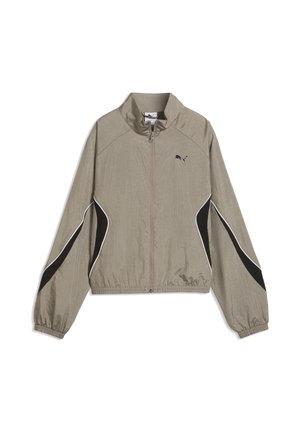 Beige Puma Jacke mit Reißverschluss, schwarzen und weißen geschwungenen Streifen auf den Ärmeln, elastischen Bündchen und Saum sowie einem Stehkragen.