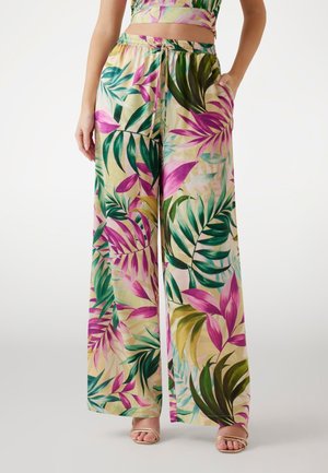 Pantaloni ampi a fiori con vita regolabile. Realizzati in tessuto leggero, presentano vivaci motivi di foglie rosa e verdi.