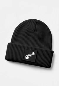 Black ribbed knit beanie featuring a fold-over cuff and a rectangular patch with a white fishbone design. Soft texture and close-fitting shape.