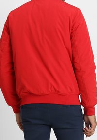 Tommy Jeans Giacca da mezza stagione - light red