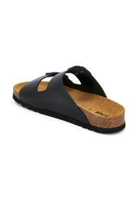 Black slide sandal with a cork footbed, rubber sole, and cut-out upper design. Features adjustable strap for a secure fit.
