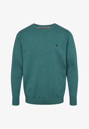 Roheline pehme materjalist pullover, millel on soonikuga kaelus ja mansetid ning väike logo rinnal. Klassikalise lõikega pika varrukaga.