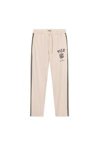 Cream-colored sweatpants with green side stripes, elastic waistband, and "YALE" graphic print along with a bulldog emblem.