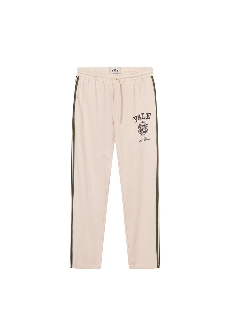 Krämliknande sweatpants med gröna sidostråkar, elastisk midja och "YALE" grafisk utskrift tillsammans med en bulldog-symbol.