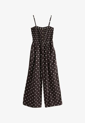 Brun jumpsuit med vita prickar, med justerbara axelremmar, en elastisk bodice och en vid byxdelsdesign med sidofickor.