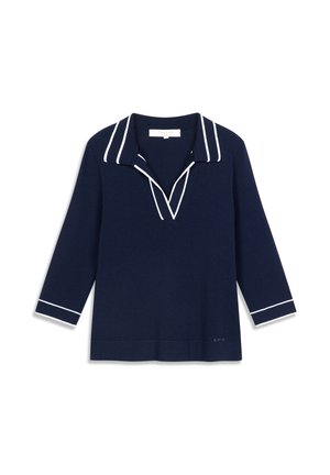 Navy knit top with a V-neck collar, featuring white piping along the collar and cuffs. Long sleeves, relaxed fit, and a straight hem.