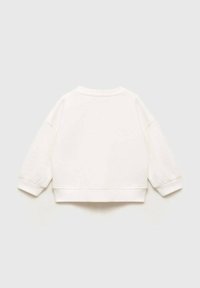 Valkoinen collegepaita, jossa on lyhennetty muotoilu, pyöreä kaula-aukko ja pitkät, hieman h puffatut hihat. Sileä pinta, ribatulla hihansuilla ja helman yksityiskohdilla.