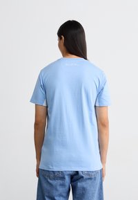 Ellesse DINELLI TEE - Triko s potiskem - light blue