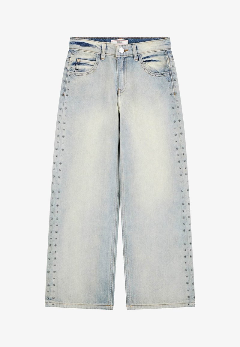 Jeans de mezclilla de corte ancho en azul claro con cintura alta, que presentan tachuelas decorativas a lo largo de las costuras laterales y un acabado desgastado.