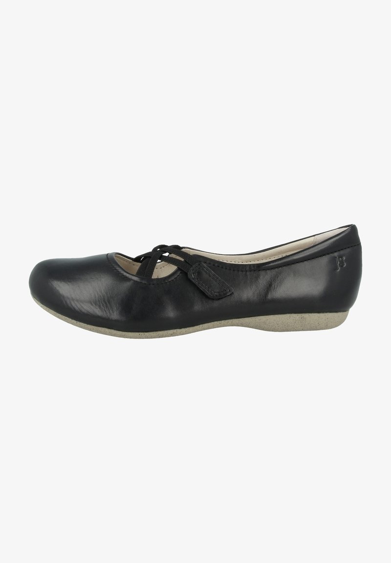 Chaussure plate en cuir noir avec bout arrondi, semelle beige, et lacet décoratif noir croisé sur le dessus.