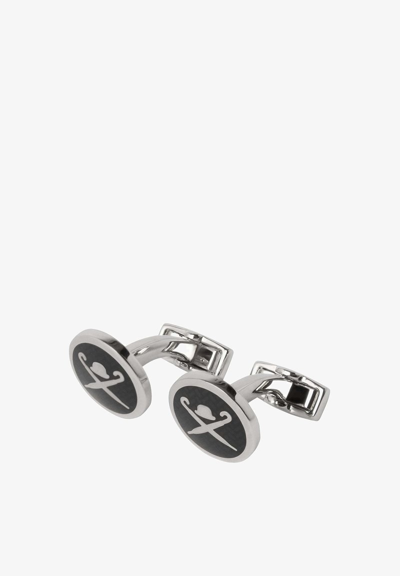 Cuflinksi srebrne boje s okruglim crnim umetcima koji prikazuju bijeli dizajn ukriženih mačeva i šešira, uz elegantan, polirani metalni završetak.