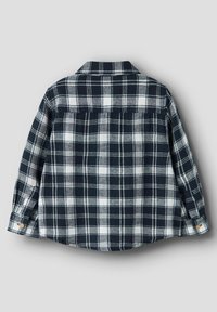 Marineblå og hvit rutete flanellskjorte med knappet krage, lange ermer og buet skjortehem. Myk tekstur med rutemønsterdetaljer.