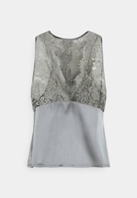 Haut gris sans manches avec un panneau dorsal en dentelle orné de motifs floraux et un devant en tissu uni et lisse.