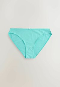 Culotte bikini femme en coton turquoise avec petit détail nœud devant, posée à plat sur un fond neutre.