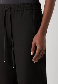 BOSS TILDINA - Tygbyxor - black