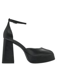 Chaussure à plateforme à talon haut en cuir noir avec bride à la cheville et talon bloc épais, vue de profil sur fond blanc.