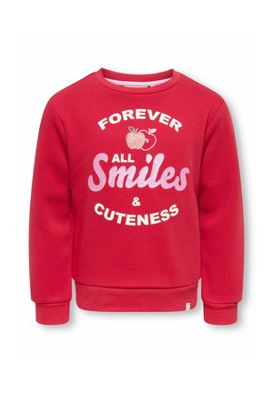 Sweat-shirt rouge à manches longues avec texte pailleté rose et blanc « Forever All Smiles & Cuteness » et deux petites illustrations de pommes sur la poitrine.