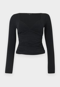 Top negru cu mâneci lungi, cu un design ajustat, decolteu în V și detaliu cu talie strânsă. Fabricat dintr-un material neted și elastic.