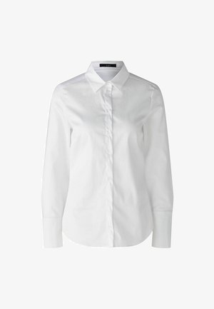 Weißes Hemd mit langen Ärmeln, klassischem Kragen und glattem Baumwollstoff. Mit einer Knopfleiste vorne und taillierter Passform.
