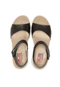 Sandalias de cuero negro con una correa ancha sobre el pie, correa ajustable en el tobillo y una plantilla acolchada de color beige. Suela de goma blanca.