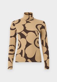 Μπεζ πουλόβερ με ψηλό λαιμό και μακριά μανίκια, διακοσμημένο με μεγάλα σκοτεινά καφέ αφηρημένα λουλουδένια μοτίβα.