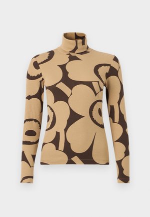 Pull à col roulé beige à manches longues avec de grands motifs floraux abstraits de couleur marron foncé.