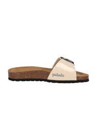 Beige patent slide sandal with cork footbed, black outsole, and decorative buckle feature. Brand name "palado" printed on side.