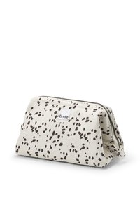 Cosmetisk taske i canvas i beige med sorte abstrakte prikker, med lynlåslukning og hvidt mærke. Struktureret form med en flad bund.