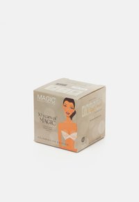 Emballage de ruban adhésif en dentelle de luxe en beige avec un texte noir, comportant des illustrations et des instructions, avec un graphique d'une femme dans un design en dentelle.