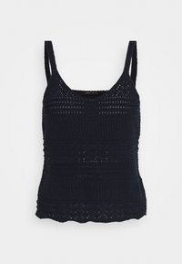 Laivastonsininen neuleliivi säädettävillä olkahihnoilla, jossa on teksturoitu kuvio ja aallotettu helma. Valmistettu kevyestä ja hengittävästä materiaalista.