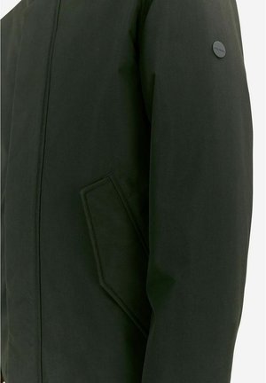 Dark green jacket made of smooth fabric with a clean design, featuring a side pocket and a circular logo on the upper arm.