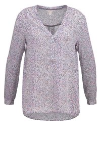 Blouse à manches longues avec un petit motif à pois multicolores, col en V et patte de boutonnage à trois boutons.