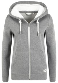 Gray zip-up hoodie with a white faux fur lining, drawstrings, and front pockets. Features ribbed hem and logo tag at the bottom.