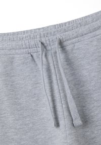 Grijze katoenen joggingbroek met een elastische tailleband met trekkoord, een zachte textuur en zonder zichtbare patronen of versieringen.
