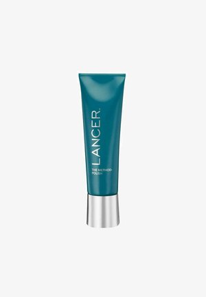 Teal tube with a silver base, labeled "LANCER THE METHOD: POLISH." Smooth texture, sleek design, and prominent brand name in white font.