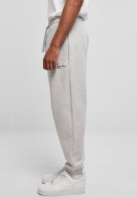 Karl Kani SMALL SIGNATURE UNISEX - Spodnie treningowe