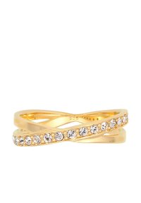 Anello in metallo color oro con un design infinito, decorato con pietre trasparenti su un lato e una superficie liscia e lucida sull'altro.