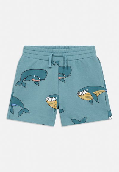Gyermek türkiz rövidnadrág elasztikus derékrésszel és húzózsinórral, mosolygó rajzfilm bálnákkal kék és sárga színben díszítve.