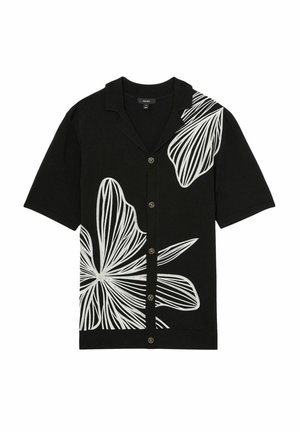 Camisa negra de manga corta con gran bordado floral blanco, cierre de botones en la parte delantera y cuello extendido. Textura suave con un diseño informal.