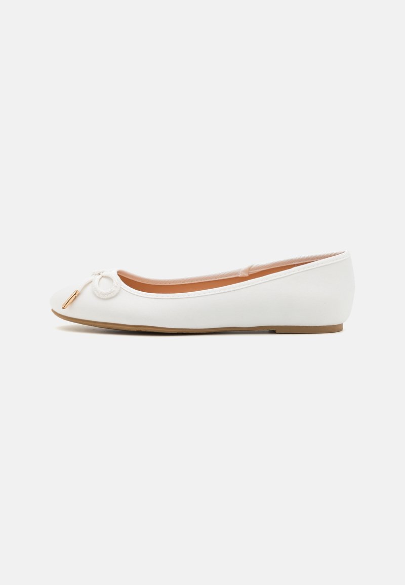 White ballet flat with a smooth fabric upper, rounded toe, and a decorative loop accent. Low-profile sole with a light, flexible design.