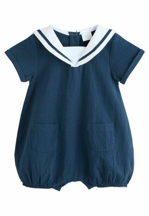 Granatowy romper z krótkim rękawem, z białym kołnierzykiem marynarskim i granatowymi paskami, z dwoma przednimi kieszeniami i elastycznymi nogawkami.
