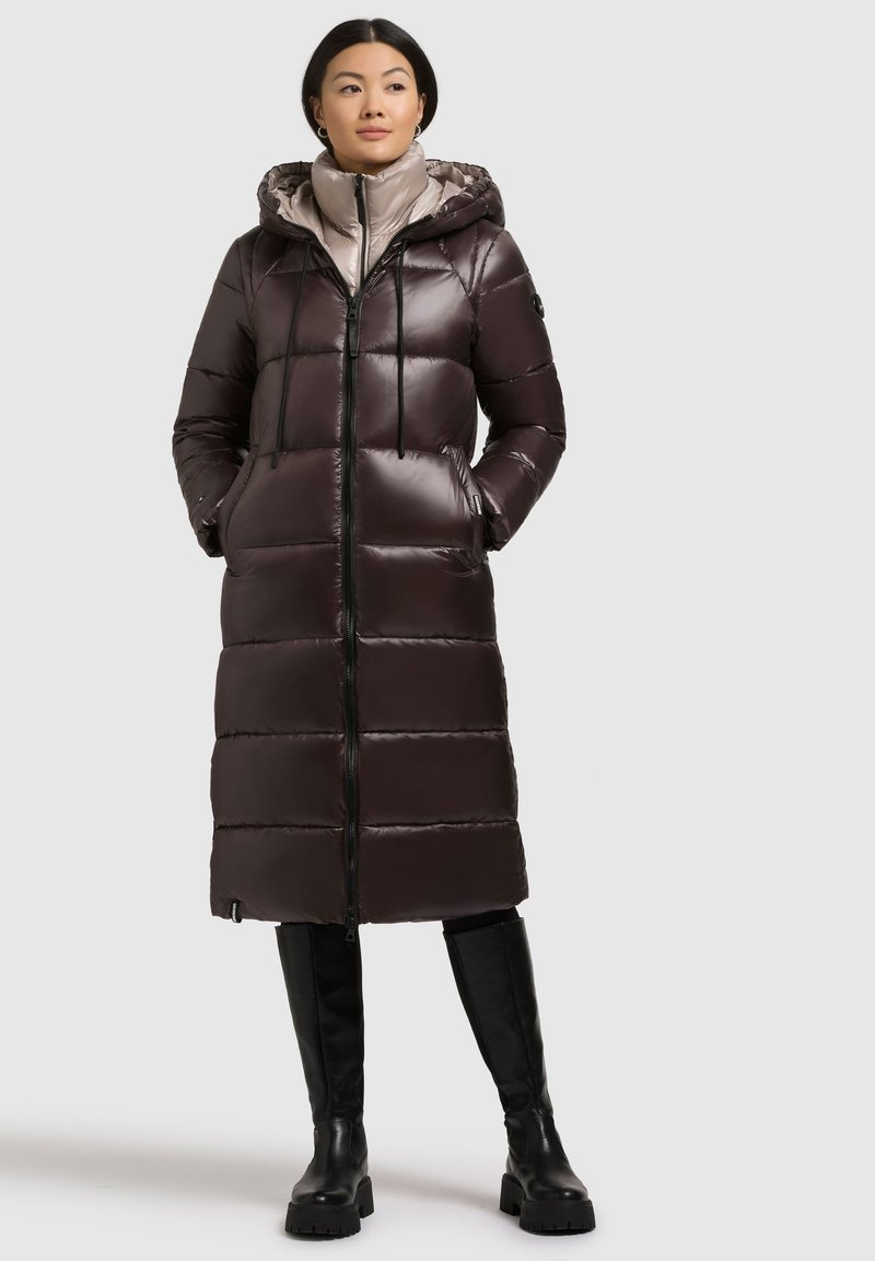 Long, dark brown quilted puffer coat with a zip front, hood, and two side pockets. Smooth, shiny fabric with a lightweight feel.